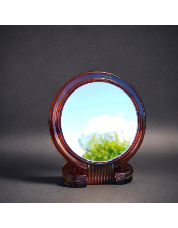 Miroir de poche double face, poignée en bakélite.