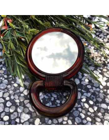 Miroir de poche double face, poignée en bakélite.