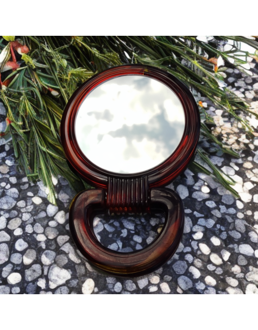 Miroir de poche double face, poignée en bakélite.